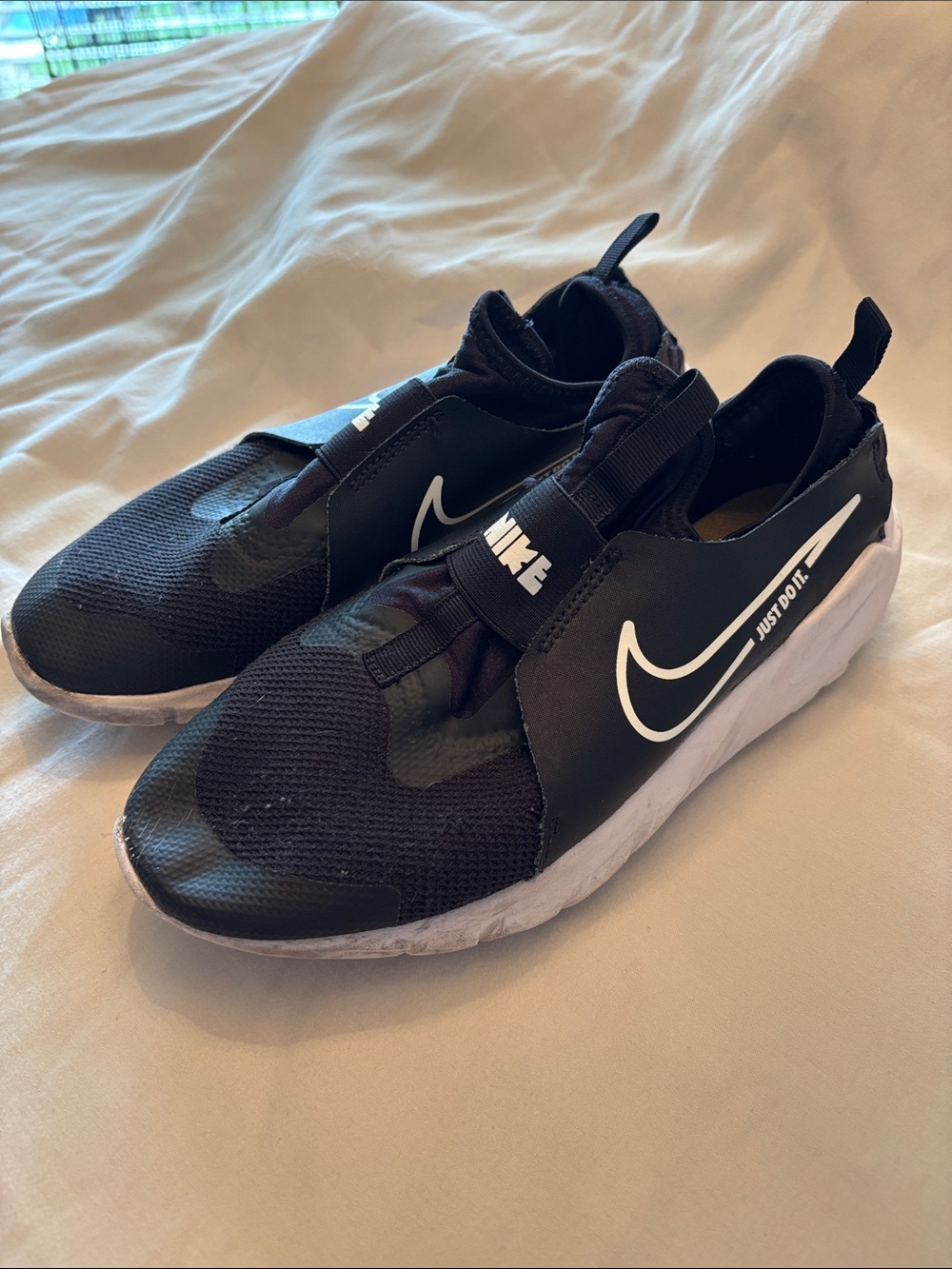 Nike Kids Black and White Slip-On Sneakers